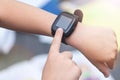 A close-up of child`s hands with smart watch. Touching electronic watch Royalty Free Stock Photo