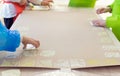 Close-up of a children in art therapy class drawing, painting and practicing engraving art. Child education in primary school at