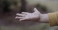 Children hand playing in the rain.