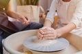 Close-up of children hands working behind the potter`s wheel Royalty Free Stock Photo