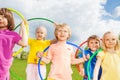 Close-up of children holding hula hoops in park Royalty Free Stock Photo