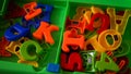 Close up of children`s toys in the form of letters and numbers from plastic material for the learning process Royalty Free Stock Photo