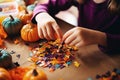 Close-up of children& x27;s hands making Halloween craft, Generative AI