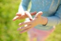 Close-up of childs hands with a ladybug. Child exploring nature