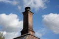 close-up of chimney, with smoke rising from the top