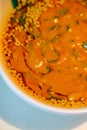 Close-up of Chinese eating hot pot with dipping sauce, sesame sauce