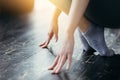 Close up. Chinese girl is engaged in stretching feet. Sports training at home