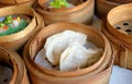Close up Chinese gyoza steamed dumplings in bamboo basket in dim sum Royalty Free Stock Photo