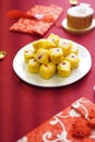 Chinese snacks rice or wheat dough enclosing minced meat and steamed on red color textile Chinese New Year