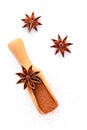 Close up chinese star anise in wooden scoop isolate on white background. Dried star anise spice fruits top view and copy space