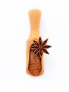 Close up chinese star anise in wooden scoop isolate on white background. Dried star anise spice fruits top view and copy space