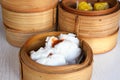 Close up Chinese steamed red pork bun is break can see pork inside in bamboo basket on table