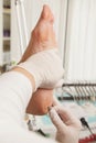 Chiropodist removes skin on a wart with Royalty Free Stock Photo
