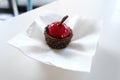 Close up of chocolate cake with candied cherry