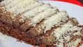 Close up of chocolate cake with cheese topping on a plate Royalty Free Stock Photo