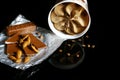 Close-up of chocolate ice cream, milk chocolate and almonds, coffee beans isolated on black background, with space for your logo o Royalty Free Stock Photo