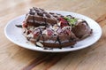 Close up of chocolate ice cream with waffle and fresh strawberry on wood table background Royalty Free Stock Photo