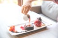 Close up the chocolate lava dessert with strawberry ice cream on white plate Royalty Free Stock Photo