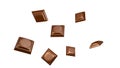 Close up of chocolate pieces stack falling on white background