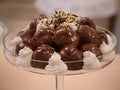 Close up chocolate profiterole filled with cream