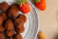 Close up of chocolate truffel candies on plate Royalty Free Stock Photo