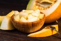 Chopped melon in a wooden bowl close Royalty Free Stock Photo