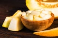 Chopped melon in a wooden bowl close Royalty Free Stock Photo