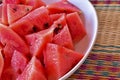 Close up of chopped red watermelon in white plate put on local m Royalty Free Stock Photo