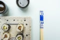 close-up of chopsticks, california roll, avocado maki, soy sauce Royalty Free Stock Photo