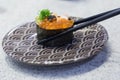 Close up chopsticks hold on sushi fresh salmon. Japanese food for healthy. Royalty Free Stock Photo
