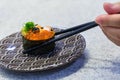 Close up chopsticks hold on sushi fresh salmon. Japanese food for healthy. Royalty Free Stock Photo