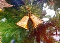 Close up christmas accessories hanging on decorated with lights Christmas tree. Christmas decorations on a spruce branch, copy Royalty Free Stock Photo