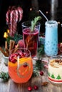 Close up of Christmas cocktails against a festive dark background.
