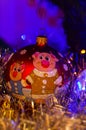 Close-up of Christmas decorations and toys with the image of a pig with a soft blurred background.
