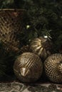 Close up of Christmas display showing golden wood ball ornaments