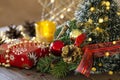 Close-up Christmas festive background with a Christmas tree decorated with balls and pine cones and beads, gifts, golden