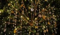 Close-up of Christmas fir tree decorations with precious crystal pendants and rose flowers