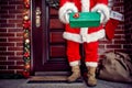 Close up of Christmas gift in Santa Claus hands, concept Royalty Free Stock Photo