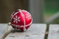 Close up of christmas red ball hanging on green background Royalty Free Stock Photo