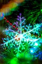 Close-up of a Christmas snowflake toy on a Christmas tree