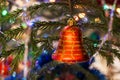 Close-up christmas toy red bell, painted with gold, is hanging o Royalty Free Stock Photo