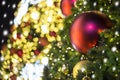 Close up of Christmas tree decorated with red and gold ball with Royalty Free Stock Photo
