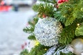 Close up of christmas tree decorated with silferr sparkling balls and garland with lights on. Festive background with copy space Royalty Free Stock Photo