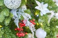 Close up of christmas tree decorated with silver sparkling balls and garland with lights on. Festive background with copy space Royalty Free Stock Photo