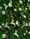 Close up Christmas tree decoration with red, gold, silver, and white balls, silver star and white reindeer. Xmas background. Royalty Free Stock Photo