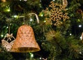 Close up of Christmas Tree with Glittering Bell and Decorations