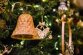 Close up of Christmas Tree with Glittering Bell and Ribbon