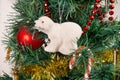 Close-up on the Christmas tree, its polar bear garland and its barley sugar