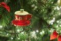 Close-Up of Christmas Tree with Ornaments and Garland with Lights