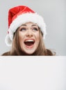 Close up christmas woman portrait behind big white card. Emotio Royalty Free Stock Photo